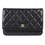 CHANEL - a black leather Wallet On Chain handbag.
