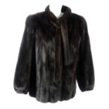 A dark ranch mink fur jacket.