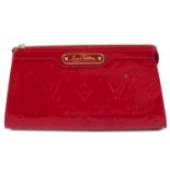 LOUIS VUITTON - a red Monogram Vernis make-up pouch.