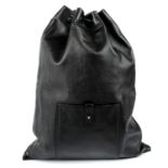 GUCCI - a black leather drawstring backpack.