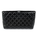 CHANEL - a black quilted clutch.