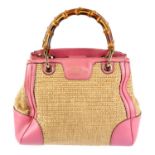 GUCCI - a bamboo straw handbag.