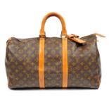 LOUIS VUITTON - a vintage Monogram Keepall 45 luggage bag.