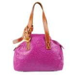 VIVIENNE WESTWOOD - a pink orb embossed leather handbag.