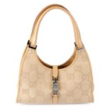 GUCCI - a beige Bardot handbag.