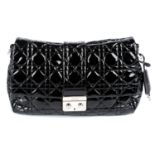 CHRISTIAN DIOR - a black patent leather Cannage handbag.