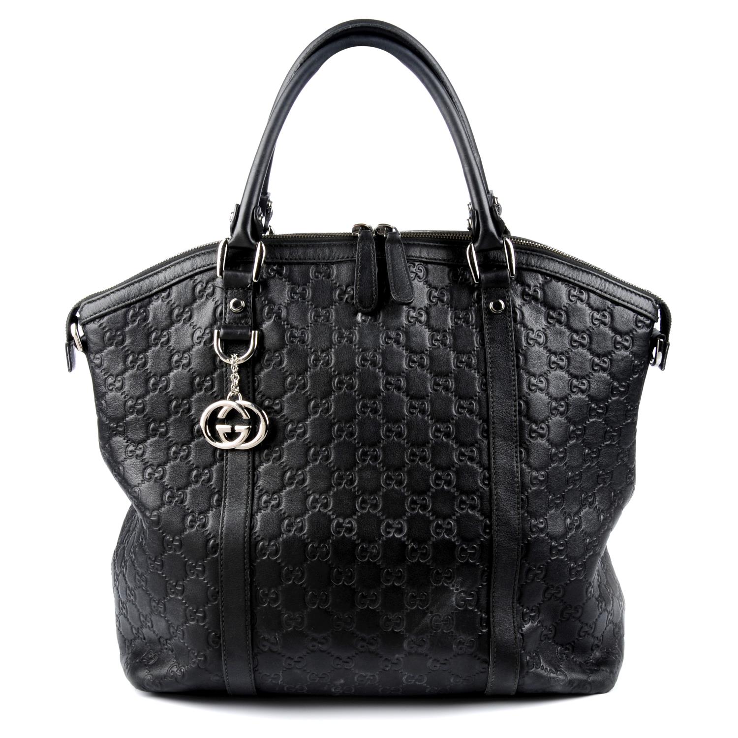 GUCCI - a black Guccissima leather handbag.