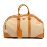 PRADA - a canvas and leather duffle bag.