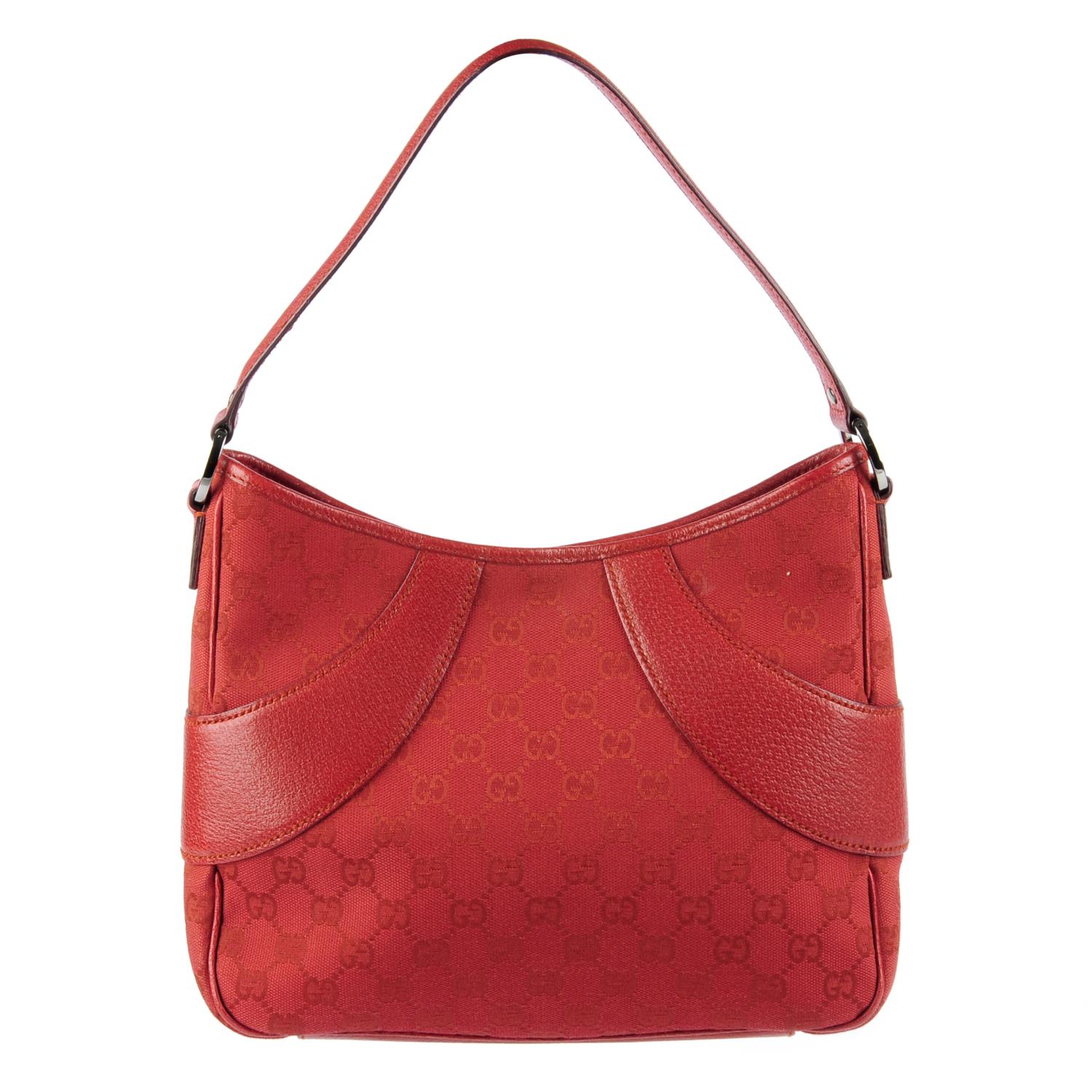 GUCCI - a red Monogram canvas handbag.