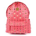 MCM - a large coral pink Stark All-Over Stud backpack.