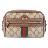 GUCCI - a Supreme Ophidia clutch.