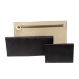 A designer purse and travel wallet.