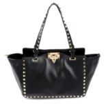 VALENTINO - a small Rockstud trapeze tote.