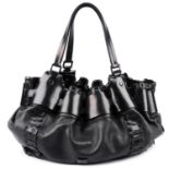 BURBERRY - a black leather handbag.