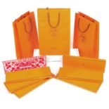 HERMÈS - a selection of tie boxes and paper bags.