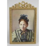 An early 20th century rectangular head and shoulder painted portrait miniature depicting an elderly