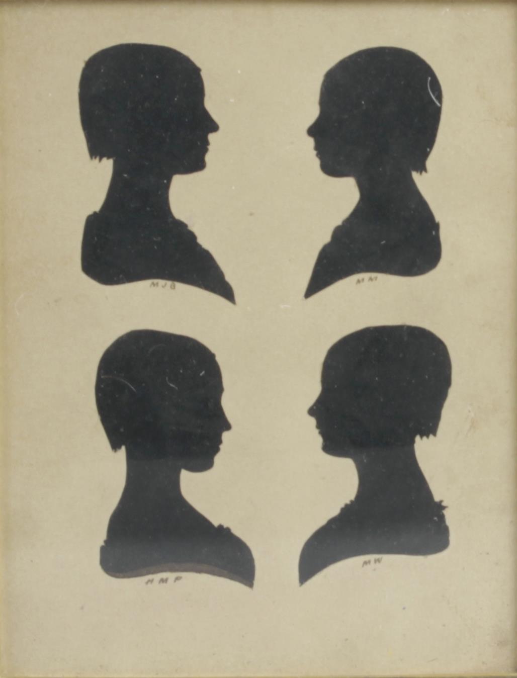 A 19th century oak framed family group of four head and shoulder portrait silhouettes,