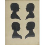 A 19th century oak framed family group of four head and shoulder portrait silhouettes,