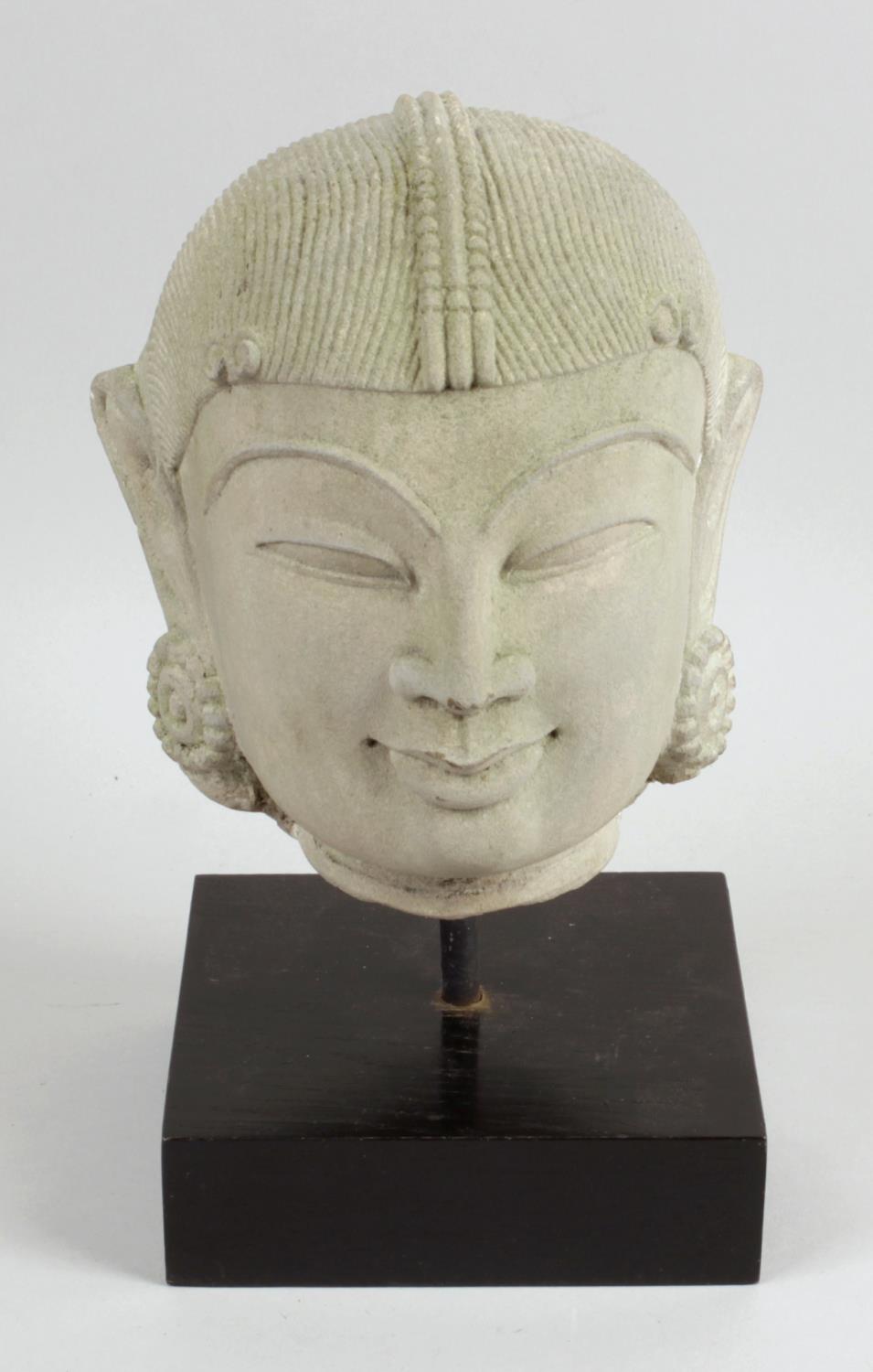 A carved stone head study of an Indian Deity,