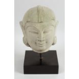 A carved stone head study of an Indian Deity,