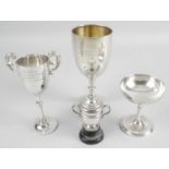 A 1930's miniature silver trophy cup and cover with twin handles and rope twist border detail,