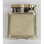 A Dunhill 9ct gold cased cigarette lighter,