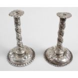 A pair of late nineteenth century small silver candlesticks,