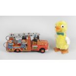 An Usagiya Japanese tinplate friction powered novelty toy modelled as a fire engine,