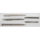 Four vintage hallmarked silver slide action pencils,