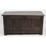 An antique oak coffer,