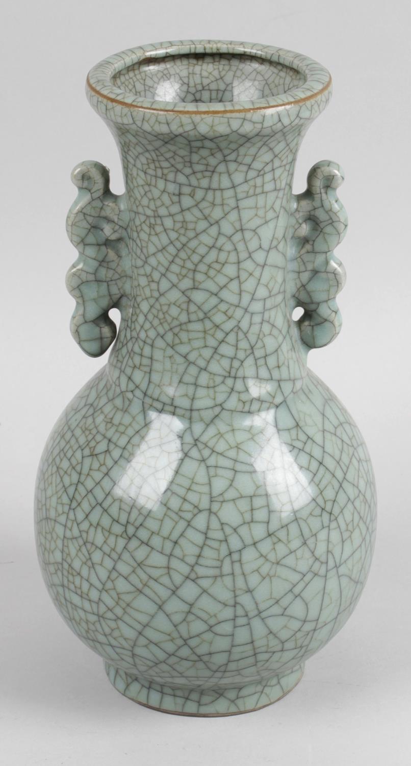 A late 19th century Chinese twin handled crackle glazed vase, 10.25 (26cm) high.