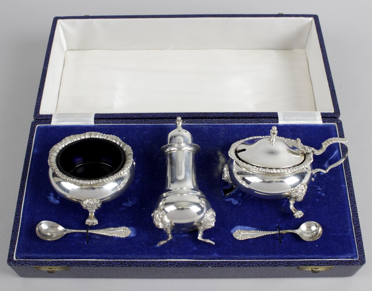 A modern silver cased condiment set,