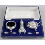 A modern silver cased condiment set,