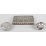 An Egyptian silver lidded box of circular form,