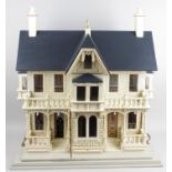 A reproduction wooden dolls house,