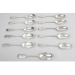 A part set of eleven George V silver Fiddle pattern dessert spoons,