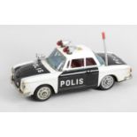 An Ichiko Japanese tinplate friction powered Polis car 'Karman Ghia' in original box.