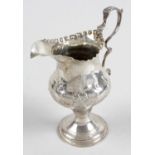 A George III silver pedestal cream jug,