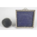 An Edwardian silver mounted photograph frame of square easel back form,