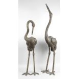 A modern cast bronze study of a heron with head raised and beak open,