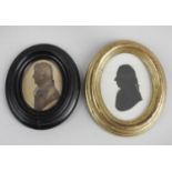 A 19th century framed and glazed oval head and shoulder silhouette,