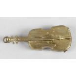 A late 19th century novelty base metal vesta case modelled as a violin, 2.75 (7cm) high.