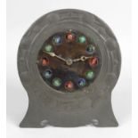 A Liberty & Co Tudric pewter, copper and enamel mantel clock designed by Archibald Knox, c.