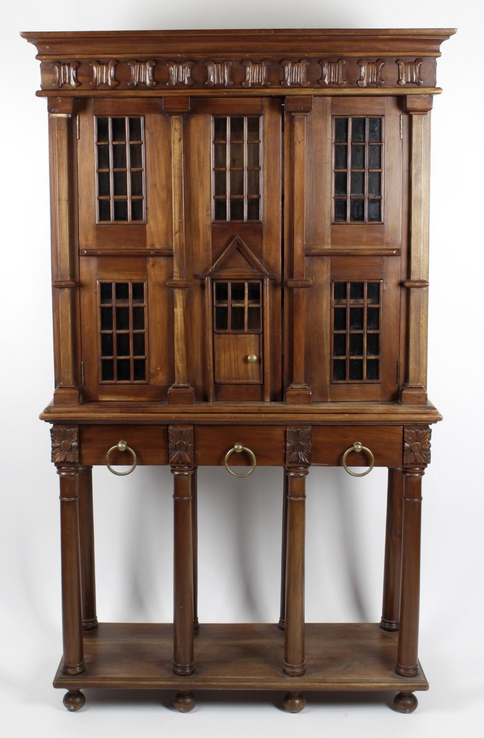 A reproduction stained mahogany bookcase,