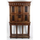 A reproduction stained mahogany bookcase,