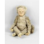 An early 20th century gold plush monkey soft toy,