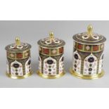 Three Royal Crown Derby Old Imari 1128 pattern graduated storage jars and covers,