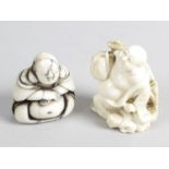 A late 19th century ivory netsuke modelled as a Buddha or Hotei carrying two baskets and with