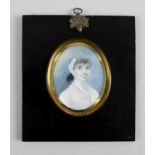 A 19th century oval painted portrait miniature on ivory,