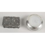 A late Victorian small silver box of circular form,
